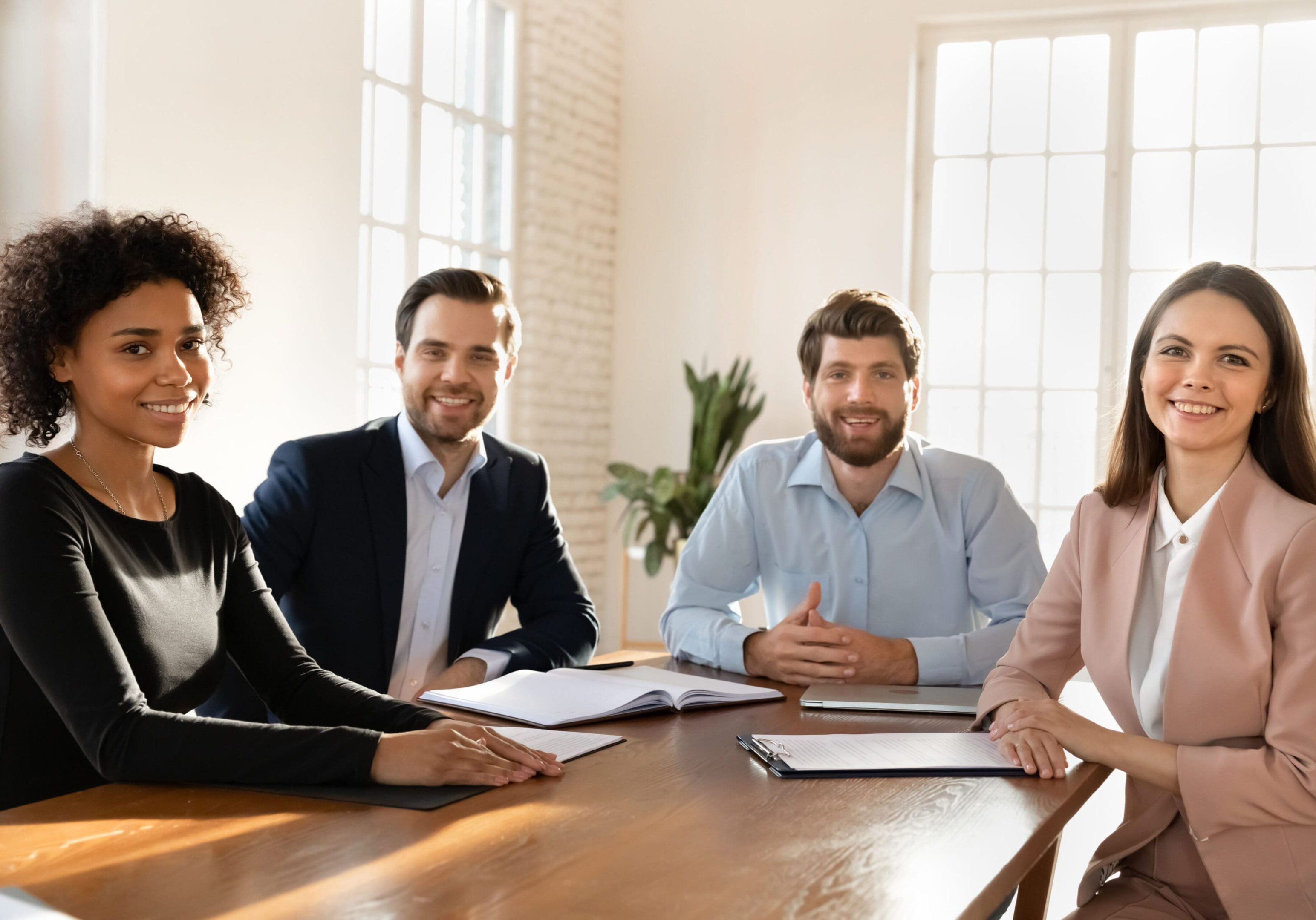 A group of people sitting at a table.